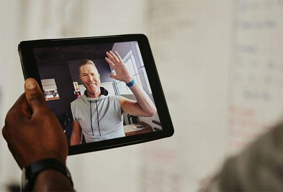 gym coach on video call in tablet