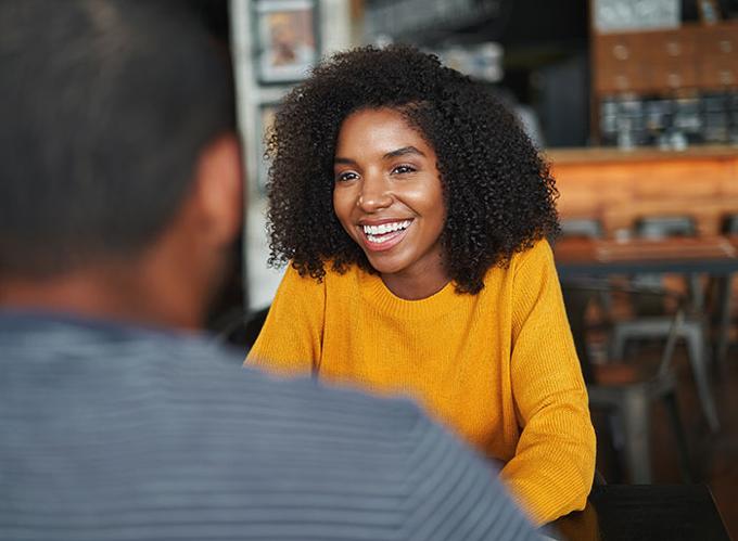 lady smiling and talking with man